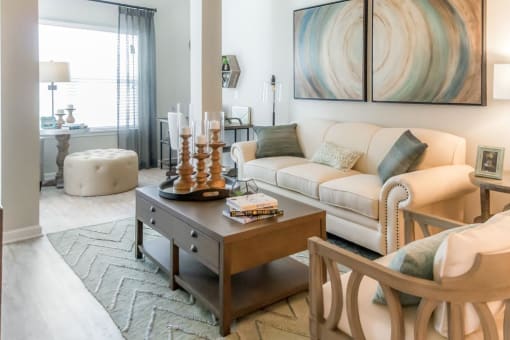 a living room with a couch and a table at Sterling Creek, Richmond Hill, 31324