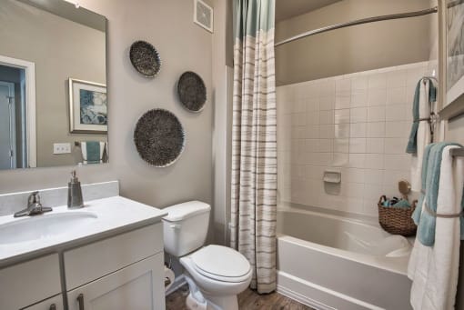 a bathroom with a sink toilet and a bath tub at Sterling Creek, Richmond Hill Georgia