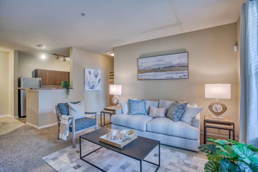 a living room with a couch and a table at Spring Creek Apartments, Crestview Florida
