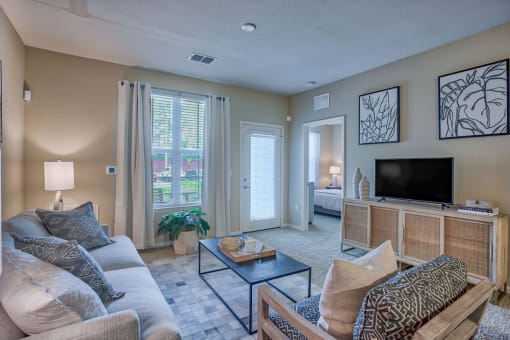 a living room with a couch and a television at Spring Creek Apartments, Florida, 32536