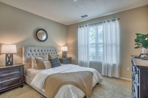 a bedroom with a large bed and a window at Spring Creek Apartments, Florida