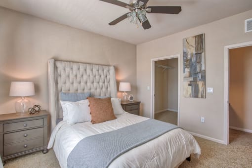 a bedroom with a bed and a ceiling fan at Spring Creek Apartments, Crestview, FL