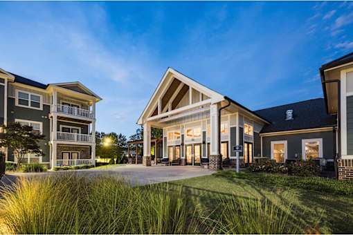 A modern house with a spacious front yard and a well-maintained lawn at Waterleaf at Neely Ferry Apartments, Simpsonville, SC 29680