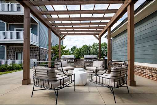 Two chairs and a table at Waterleaf at Neely Ferry Apartments, South Carolina