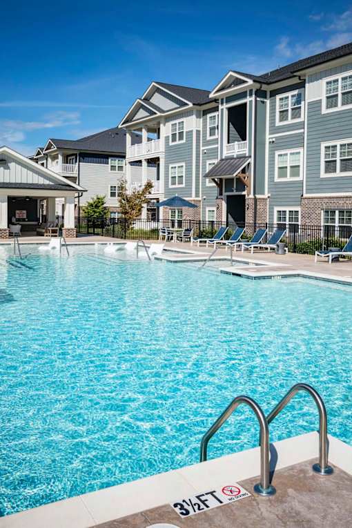 A swimming pool with a 3 feet depth sign at Waterleaf at Neely Ferry Apartments, South Carolina 29680