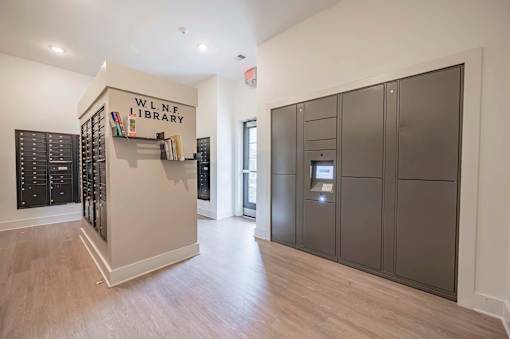A library with a wooden floor at Waterleaf at Neely Ferry Apartments, Simpsonville, SC