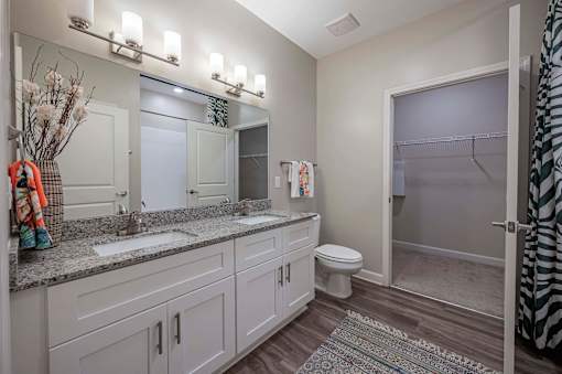 A bathroom with a toilet at Waterleaf at Neely Ferry Apartments, Simpsonville, SC 29680