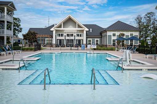 A large swimming pool in front of a building at Waterleaf at Neely Ferry Apartments, Simpsonville