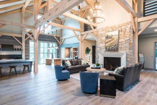 a large living room with couches and chairs and a fireplace at Bellary Flats Apartments, South Carolina, 29486