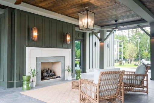a covered patio with a fireplace at Bellary Flats Apartments, Summerville , SC 29486