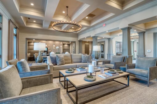 a large living room with couches and chairs and a table at Citadel at Westpointe, San Antonio