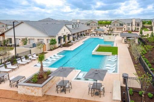 an aerial view of a swimming pool with tables and umbrellas at Citadel at Westpointe, Texas