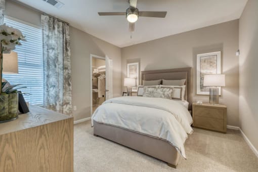 a bedroom with a bed and a ceiling fan at Citadel at Westpointe, San Antonio, Texas