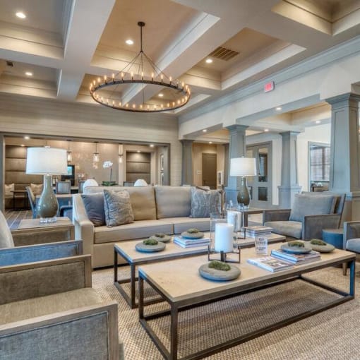 a living room with couches and tables and a chandelier at Citadel at Westpointe, San Antonio, Texas