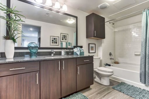 a bathroom with a sink and a toilet at Legacy Flats, San Antonio