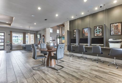 a barbershop with chairs and mirrors in a salon at Legacy Flats, San Antonio Texas