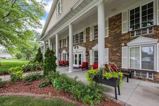 A house with a porch and a planter on the front.