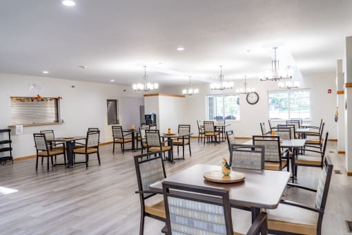 the dining room at our community center with tables and chairs