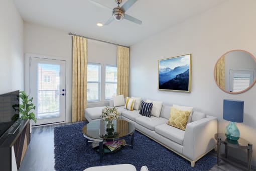 a living room with a white couch and a coffee table
