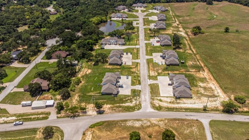an aerial view of a neighborhood of houses and roads