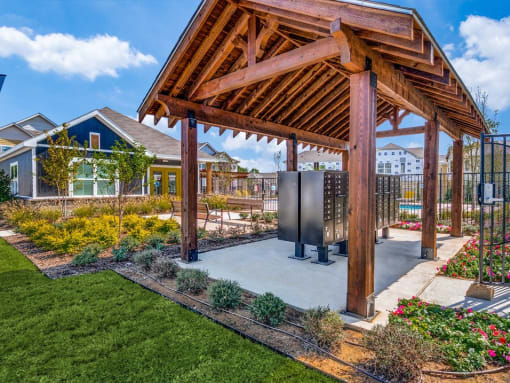 a gazebo with a hot tub in a garden