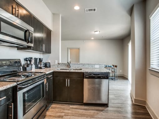 a kitchen with stainless steel appliances and a counter top