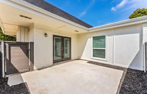 a white house with a driveway and a garage door