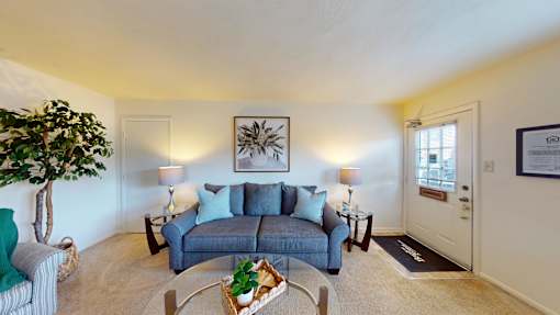 a living room with wall to wall carpet