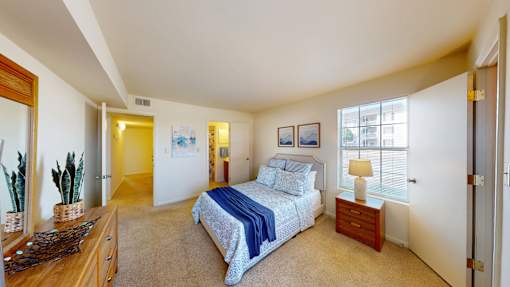 a master suite with a full bath and walk-in closet