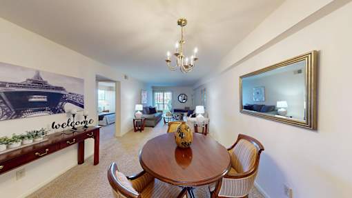a separate dining space with a chandelier