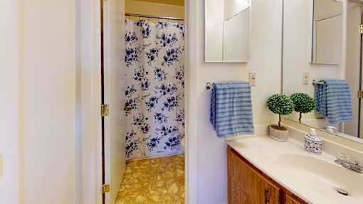 a full bath with a shower and sink