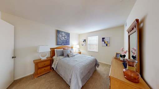 a bedroom with a window and walk-in closet