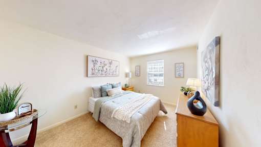 a bedroom with a window and walk-in closet