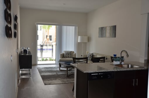 a view of the living room and dining room from the kitchen
