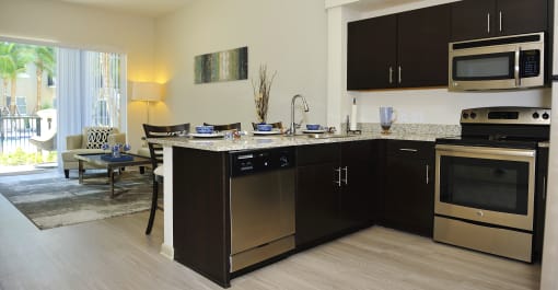 a kitchen with stainless steel appliances and a granite counter top