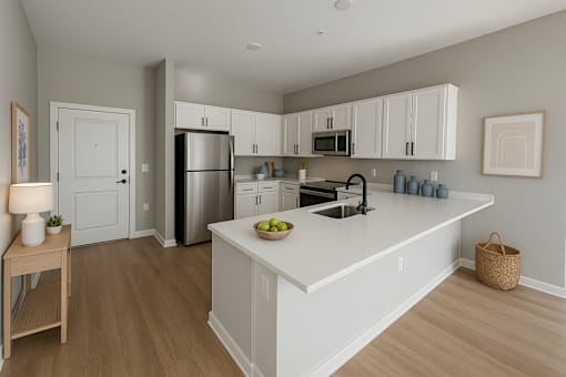 A kitchen with a refrigerator, sink, and cabinets.