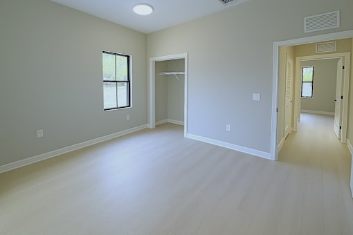 A room with a window and a door.