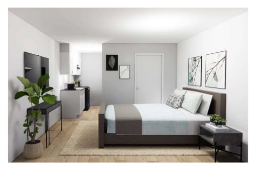 a bedroom with a bed and a tv