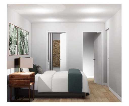 a bedroom with a bed and a desk
