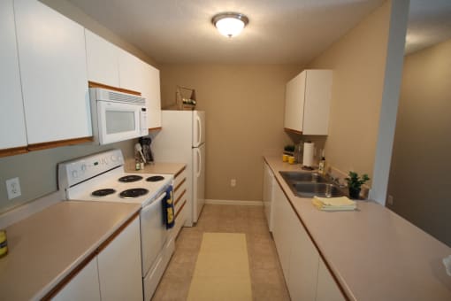 This is a photo of the kitchen in the 1040 square foot 2 bedroom Patriot at Washington Place Apartments in Washington Township, OH.