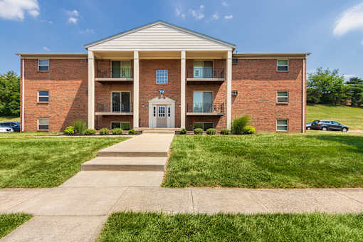 Brick apartment building with secure entry and sidewalk at Aspen Village on the west side of Cincinnati