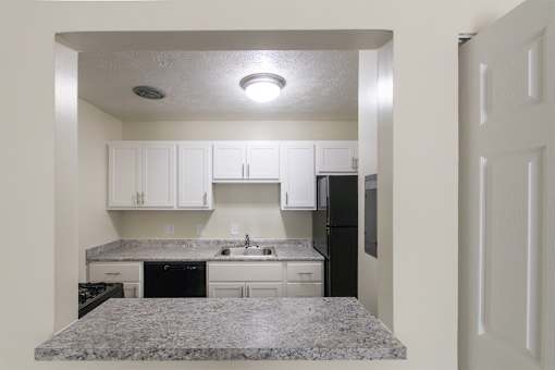 This is a photo of the kitchen pass through window in the 543 square foot A-style, 1 bedroom, 1 bath apartment at Blue Grass Manor Apartments in Erlanger, KY.