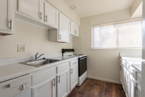 This is a photo of the kitchen in the 899 square foot, 2 bedroom, 1.5 bath apartment at Blue Grass Manor Apartments in Erlanger, KY.