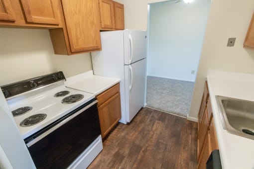 This is a photo of the kitchen in the 652 square foot, 1 bedroom, 1 bath A-style apartment at Blue Grass Manor Apartments in Erlanger, KY.