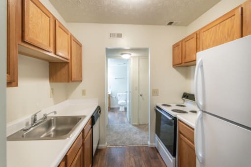 This is a photo of the kitchen in the 652 square foot, 1 bedroom, 1 bath A-style apartment at Blue Grass Manor Apartments in Erlanger, KY.
