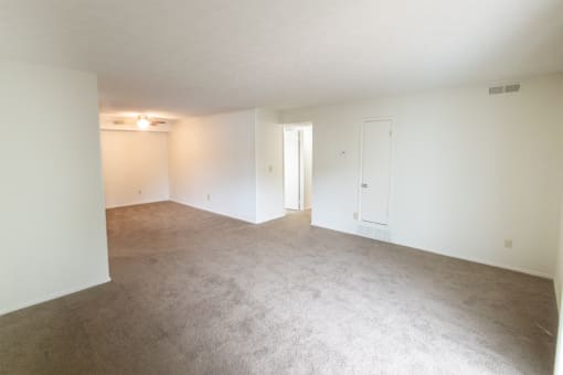 This is a photo of the living room of the 902 square foot, 2 bedroom, 1 and a half bath apartment at Blue Grass Manor Apartments in Erlanger, KY.