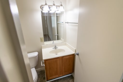 This is a photo of primary half bath in the 902 square foot, 2 bedroom, 1 and a half bath apartment at Blue Grass Manor Apartments in Erlanger, KY.