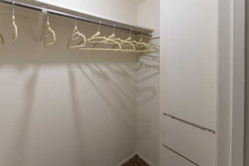 hallway walk-in closet with built-in shelving  at The Biltmore, Dallas, TX, 75231