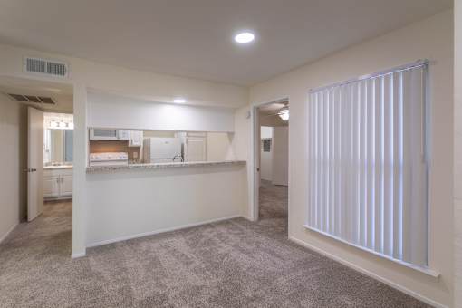 Kitchen with white cabinets and white appliances in a 2 bedroom, 1.5 bath 846 sq ft apartment home at The Biltmore Apartments located in the Vickery Midtown neighborhood of Dallas, TX.