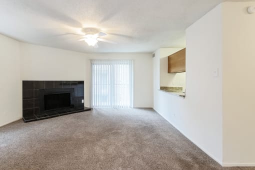 This is a photo of the living room in the 1245 square foot 2 bedroom, 2 bath apartment at Cambridge Court Apartments in Dallas, TX.